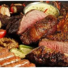 La imagen 2 de la Empresa ASADOR LA CANDELARIA Restaurante especializado en asados en San Isidro AR-B